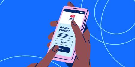 Illustration of hands holding a smartphone showing the NSW Government cookie consent interface