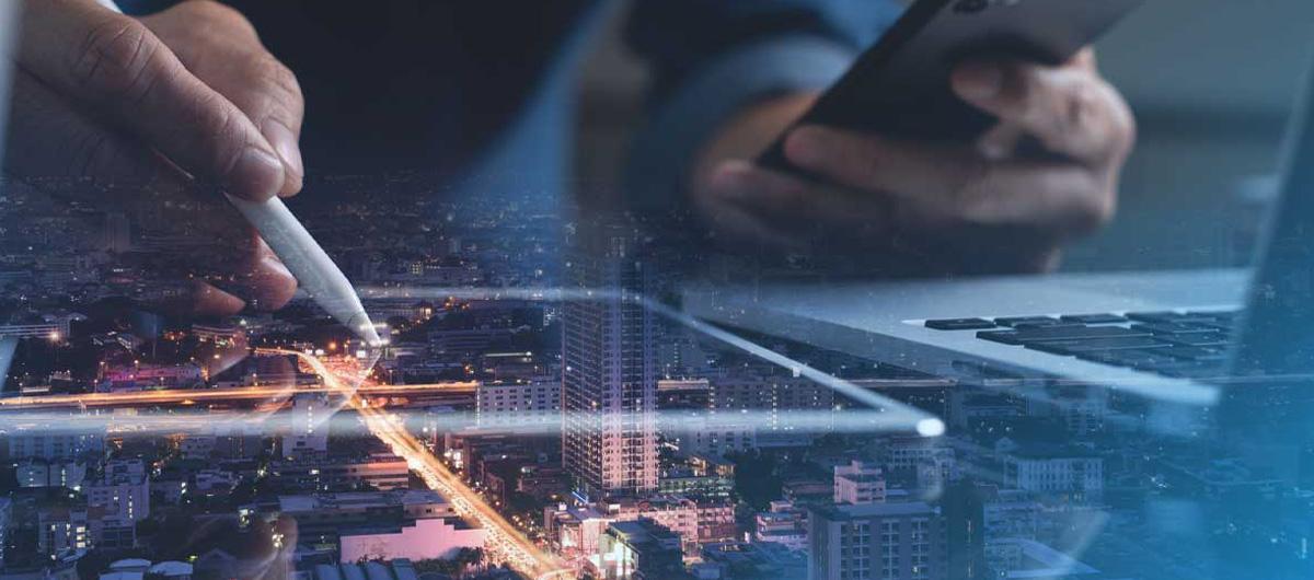 Hand writing on tablet transposed on city skyline | NSW Digital Housing Pipeline