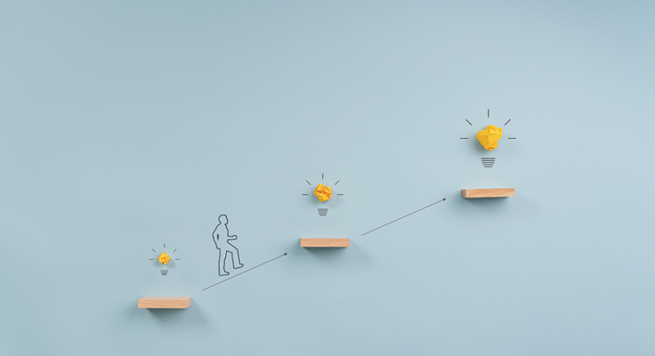 Drawn figure walking up steps with light bulbs symbolizing ideas above | Test and Buy Innovation | Digital NSW 