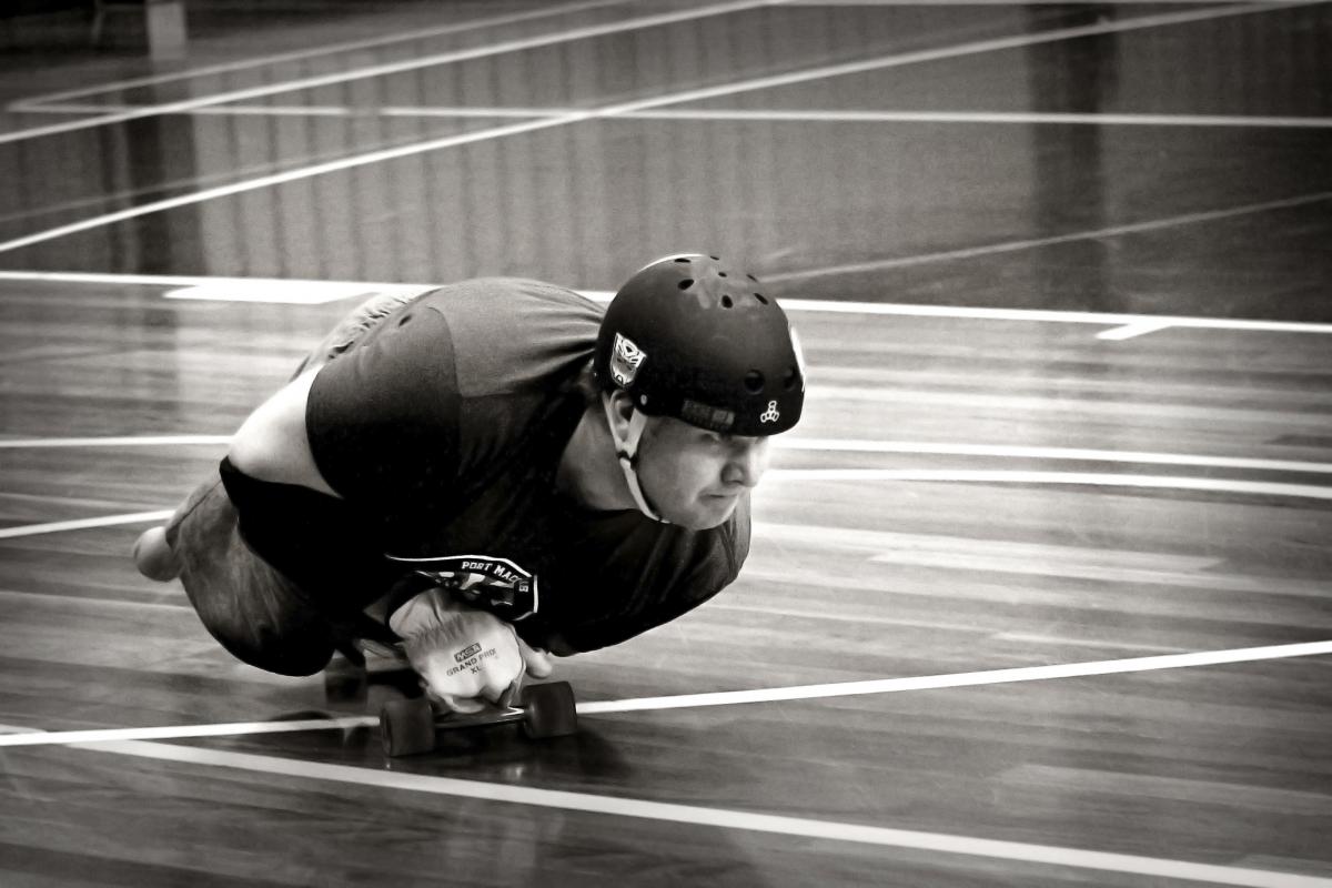 Steve on his skateboard doing roller derby